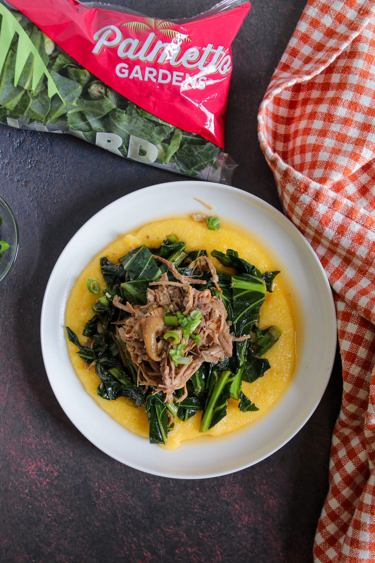 Top view of Instant Pot pulled pork with simmered collard greens and grits