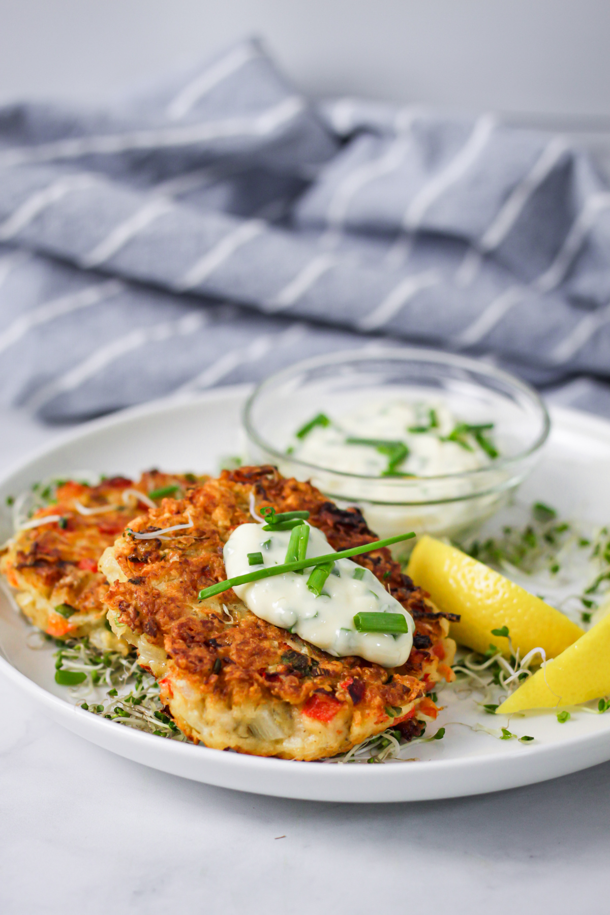 Crispy fried fish cakes\ served with tartar sauce, angled