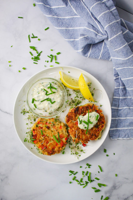 Crispy fried fish cakes served with tartar sauce, overhead